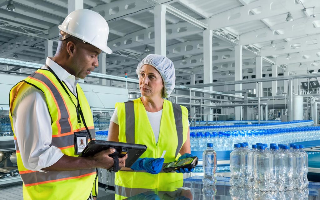 Workers in Manufacturing Plant using Mobile Computer and Scanner