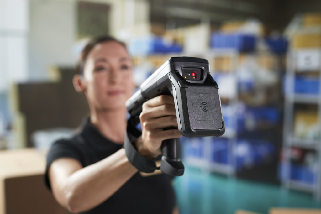 Woman using Zebra Mobile Computer in Warehouse